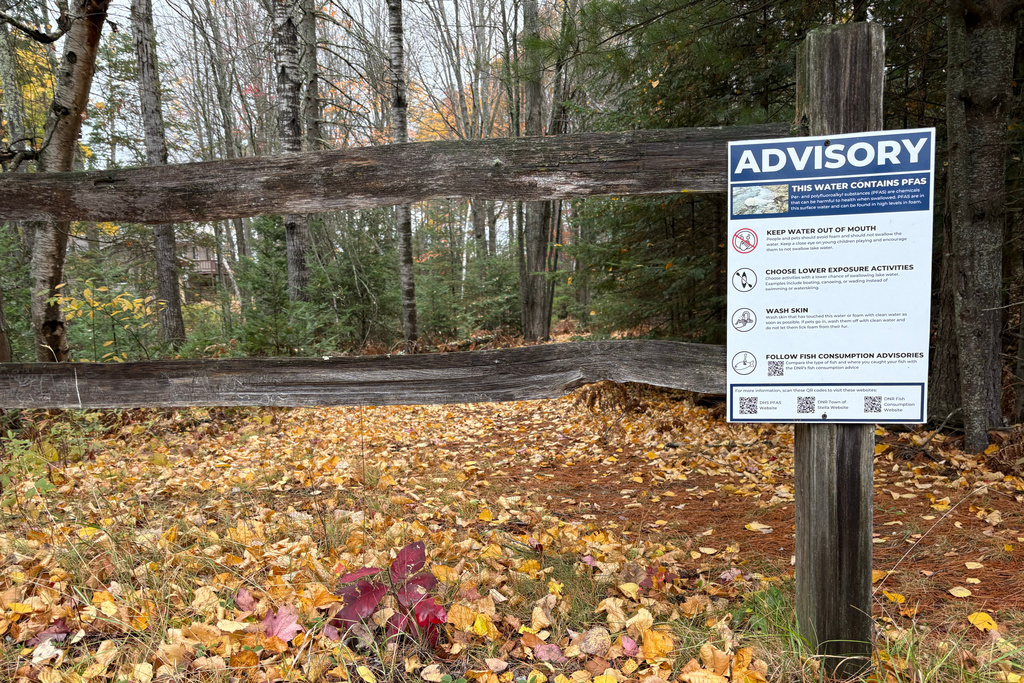 A sign warns that nearby water contains PFAS chemicals in Stella, Wis., on Oct. 21, 2025. (AP Photo/Michael Phillis)