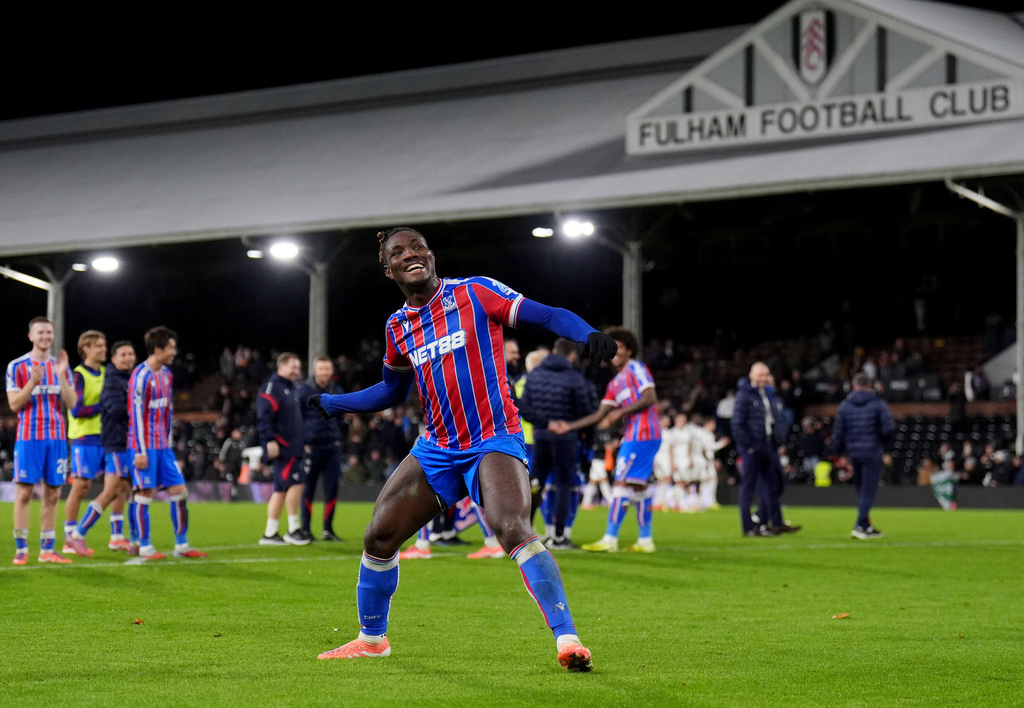 Crystal Palace's Chrisantus Uche celebrates after the English Premier League soccer match between Fulham and Crystal Palace, in London, Sunday, Dec. 7, 2025. (John Walton/PA via AP)