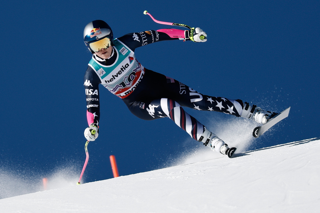 United States' Lindsey Vonn speeds down the course during an alpine ski, women's World Cup super-G event, in St. Moritz, Switzerland, Sunday Dec. 14, 2025. (AP Photo/Gabriele Facciotti)