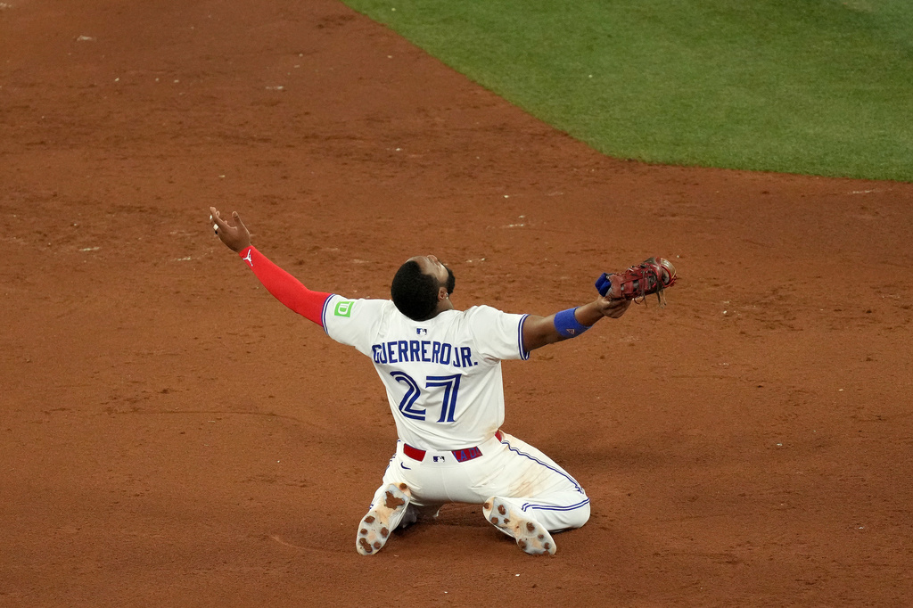 Toronto Blue Jays first baseman Vladimir Guerrero Jr. celebrates after his team's Game 7 win over the Seattle Mariners to take baseball's American League Championship Series in Toronto, Monday, Oct. 20, 2025. (Chris Young/The Canadian Press via AP)