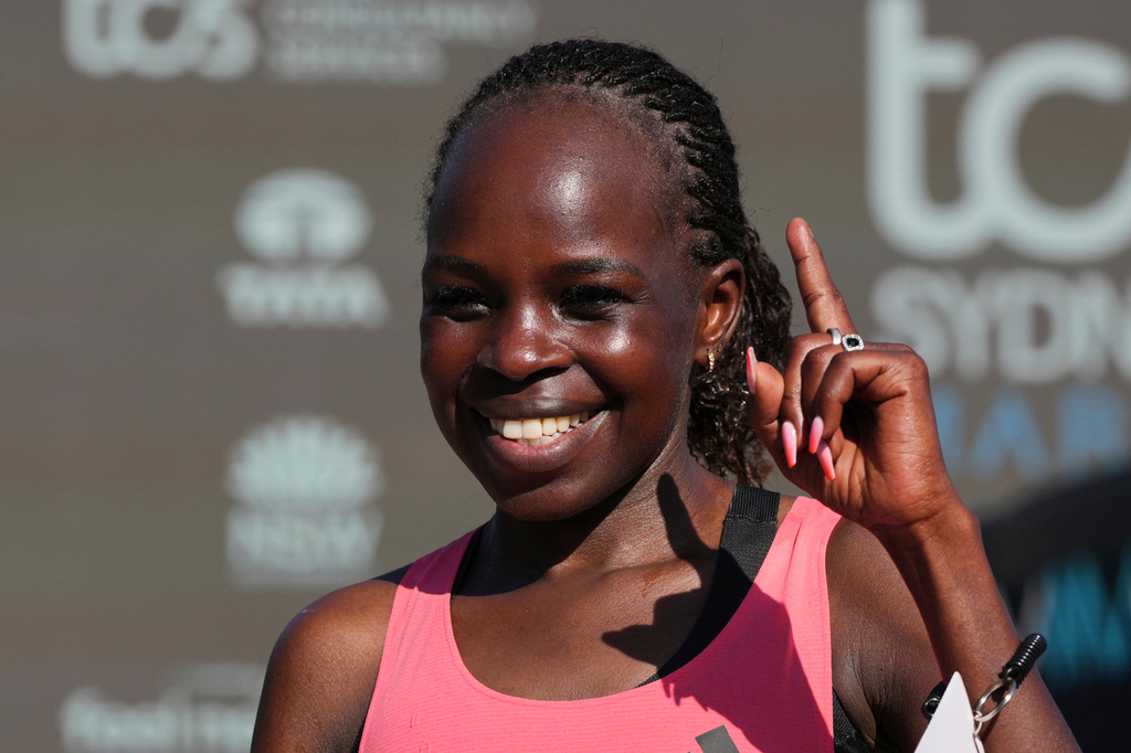 Peres Jepchirchir of Kenya reacts after crossing the finish line at the Opera House to win the women's Sydney Marathon, in Sydney, Sunday, Aug. 30, 2026. (AP Photo/Mark Baker)