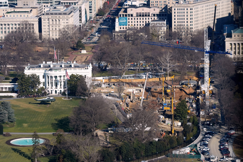 FILE - Marine One, with President Donald Trump aboard, lifts off the South Lawn, Tuesday, Jan. 13, 2006 at the White House in Washington. The new ballroom construction can be seen on the right. (AP Photo/Pablo Martinez Monsivais, File)