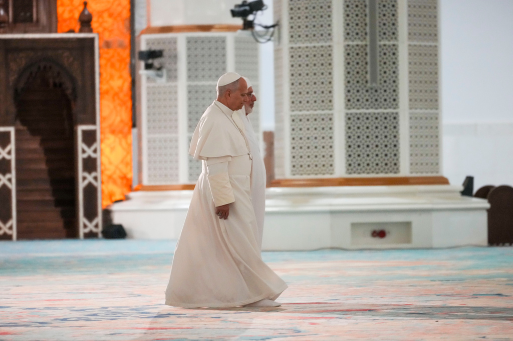 Pope Leo XIV is welcomed by Rector Mohamed Mamoun Al Qasimi upon his arrival at the Great Mosque in Algiers, Monday, April 13, 2026, on the first day of an 11-day apostolic journey to Africa. (AP Photo/Andrew Medichini)
