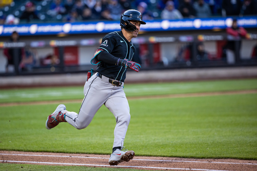 Arizona Diamondbacks' Corbin Carroll (7) triples during the seventh inning of a baseball game against the New York Mets, Wednesday, April 8, 2026, in New York. (AP Photo/Angelina Katsanis)