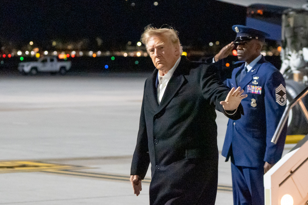 President Donald Trump waves as he arrives at Harry Reid International Airport, Wednesday, Oct. 14, 2026, in Las Vegas, Nev. (AP Photo/Alex Brandon)
