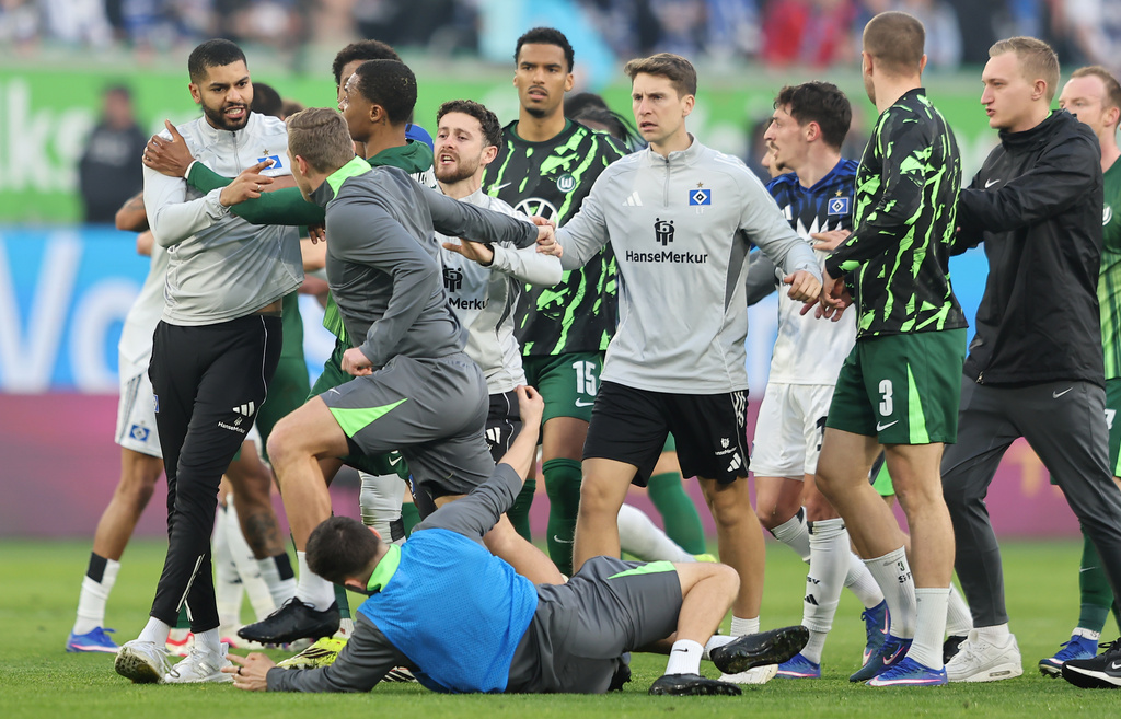 An altercation between Hamburger and Wolfsburg players following their German Bundesliga soccer match in Wolfsburg, Germany, Saturday, March 7, 2026. (Andreas Gora/dpa via AP)