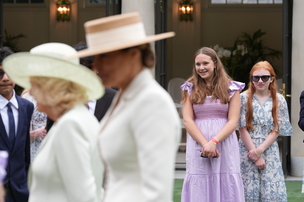 Girls smile as first lady Melania Trump and Britain's Queen Camilla attend a cultural education event at the White House Tennis Pavilion on the South Lawn of the White House in Washington, Tuesday, April 28, 2026. (AP Photo/Jacquelyn Martin)