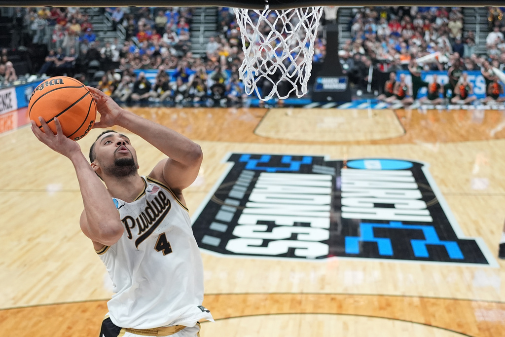 Purdue's Trey Kaufman-Renn (4) heads to the basket during the second half in the second round of the NCAA college basketball tournament against Miami, Sunday, March 22, 2026, in St. Louis. (AP Photo/Jeff Roberson)