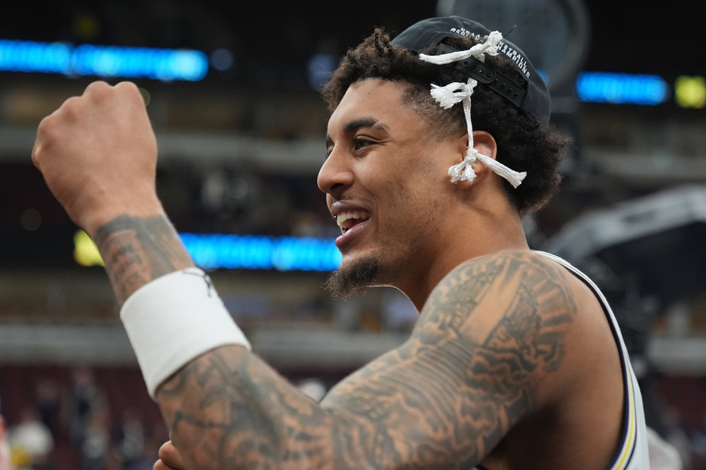 Michigan's Yaxel Lendeborg celebrates after defeating Tennessee in the Elite Eight of the NCAA college basketball tournament, Sunday, March 29, 2026, in Chicago. (AP Photo/Erin Hooley)