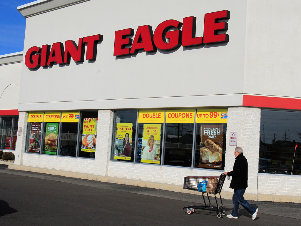 FILE - A man walks out of the Giant Eagle grocery store Thursday, Nov. 17, 2011, in Mayfield Heights, Ohio. (AP Photo/Tony Dejak, File)