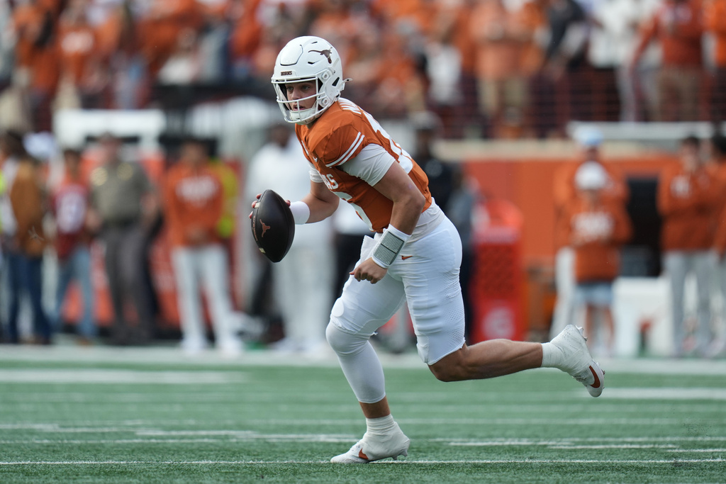 Texas quarterback Arch Manning (16) runs as he looks to throw against Vanderbilt during the first half of an NCAA college football game in Austin, Texas, Saturday, Nov. 1, 2025. (AP Photo/Eric Gay)