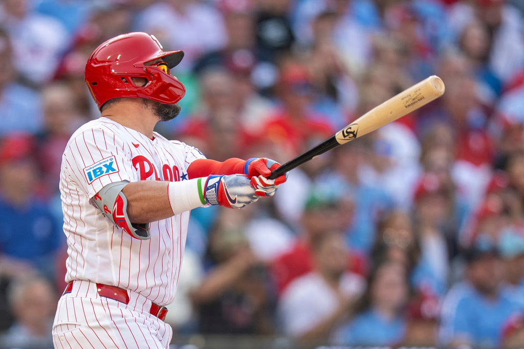 Philadelphia Phillies' Kyle Schwarber hits a two-run home run during the first inning of an opening-day baseball game against the Texas Rangers, Thursday, March 26, 2026, in Philadelphia. (AP Photo/Chris Szagola)