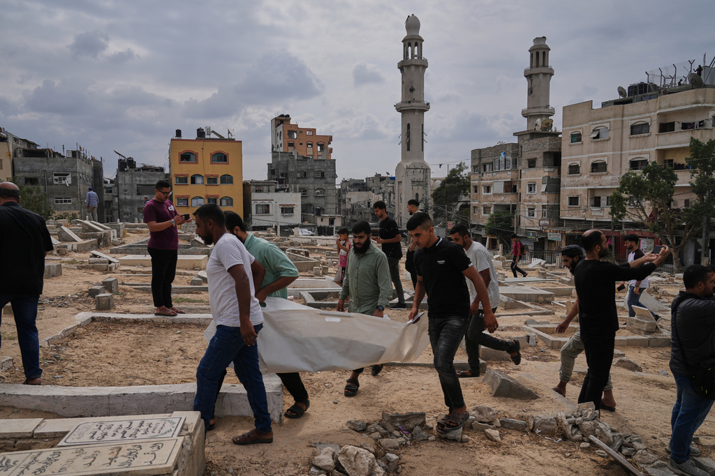 Mourners carry the remains of Palestinians killed in Israeli strikes during the war with Hamas after they were recovered from the rubble, during their funeral in Nuseirat, Gaza Strip, Tuesday, Sept. 29, 2026. (AP Photo/Jehad Alshrafi)