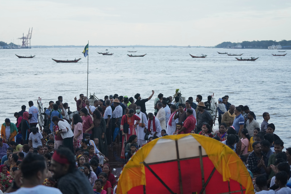 Myanmar Hindu devotees take part in the last day of the 'Durga Puja' festival in Yangon, Myanmar, Thursday, Oct. 2, 2025. (AP Photo/Thein Zaw)