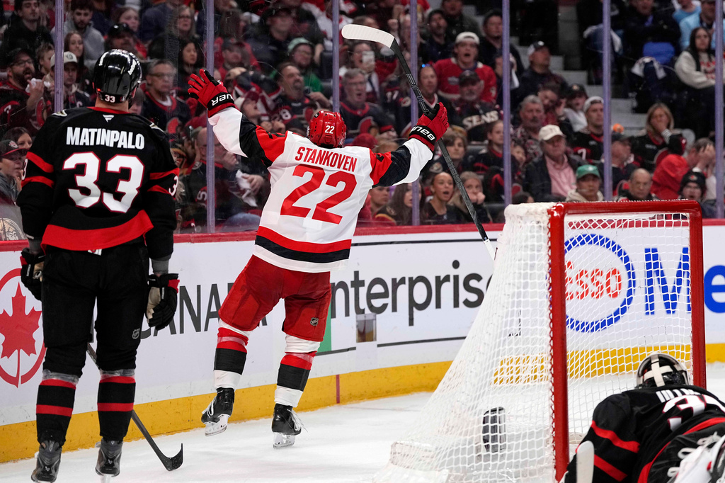 Carolina Hurricanes' Logan Stankoven (22) celebrates scoring on Ottawa Senators goaltender Linus Ullmark (35) during the third period in Game 4 of a first-round NHL Stanley Cup playoff hockey series, Saturday, April 25, 2026, in Ottawa, Ontario. (Justin Tang/The Canadian Press via AP)