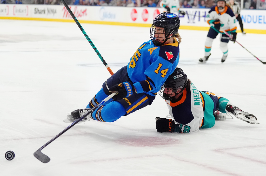Toronto Sceptres' Renata Fast (14) is taken down by New York Sirens' Maddi Wheeler (18) during the first period of an PWHL hockey game in Toronto on Tuesday, April 21, 2026. (Frank Gunn/The Canadian Press via AP)