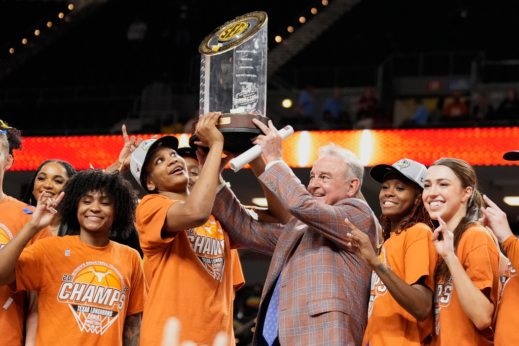 Texas celebrates after their win against South Carolina in an NCAA college basketball game in the final of the Southeastern Conference tournament, Sunday, March 8, 2026, in Greenville, S.C. (AP Photo/Chris Carlson)