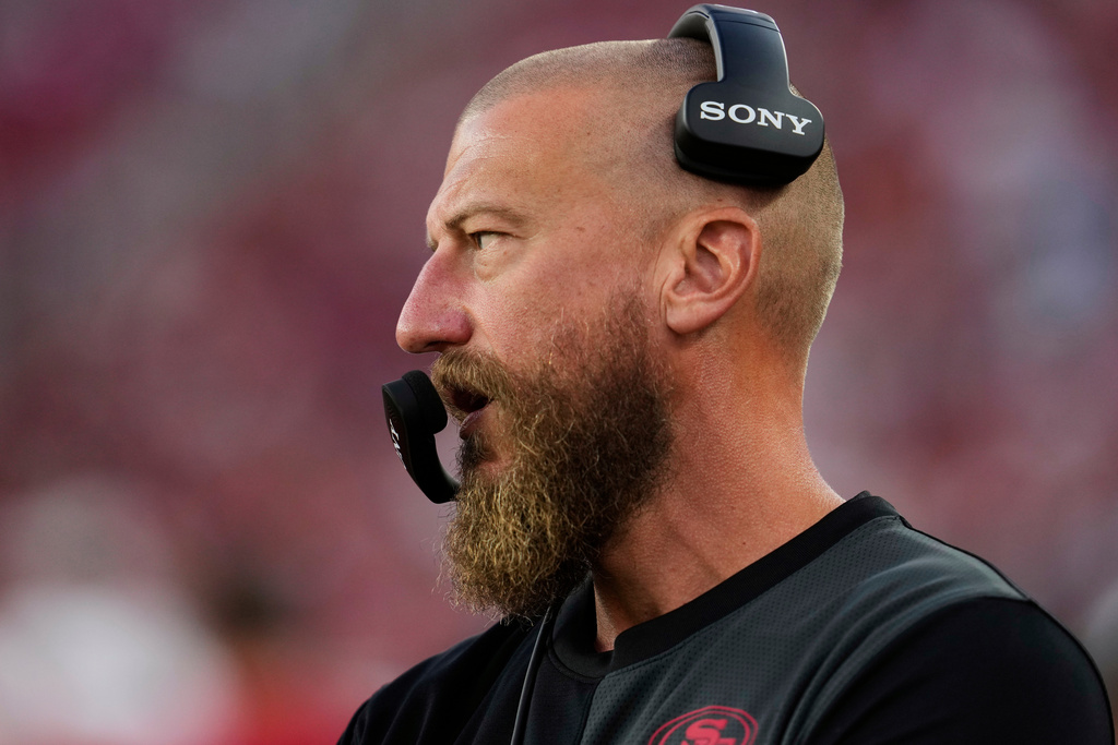 FILE - San Francisco 49ers run game coordinator/tight ends coach Brian Fleury, now offensive coordinator for the Seattle Seahawks, watches from the sideline during the second half of an NFL preseason football game against the Los Angeles Chargers, Aug. 23, 2025, in Santa Clara, Calif. (AP Photo/Godofredo A. Vásquez, File)