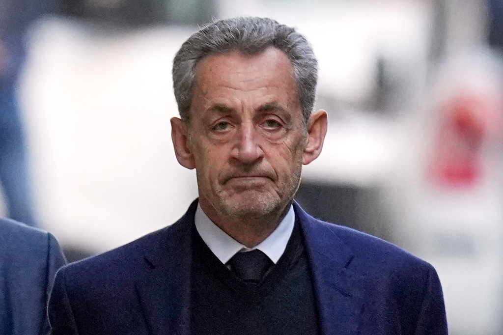 FILE - Former French President Nicolas Sarkozy leaves his home Tuesday, Oct. 21, 2025 in Paris as he heads to prison to serve time for a criminal conspiracy to finance his 2007 election campaign with funds from Libya. (AP Photo/Thibault Camus, File)