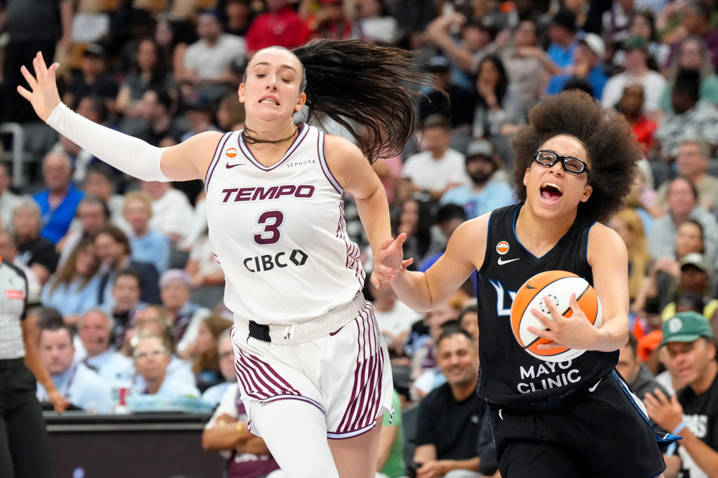 Minnesota Lynx Olivia Miles (5) Toronto Tempo Marina Mabrey (3) vie for the ball during first half of a WNBA basketball game in Toronto on Thursday, July 30, 2026. (Chris Young/The Canadian Press via AP)