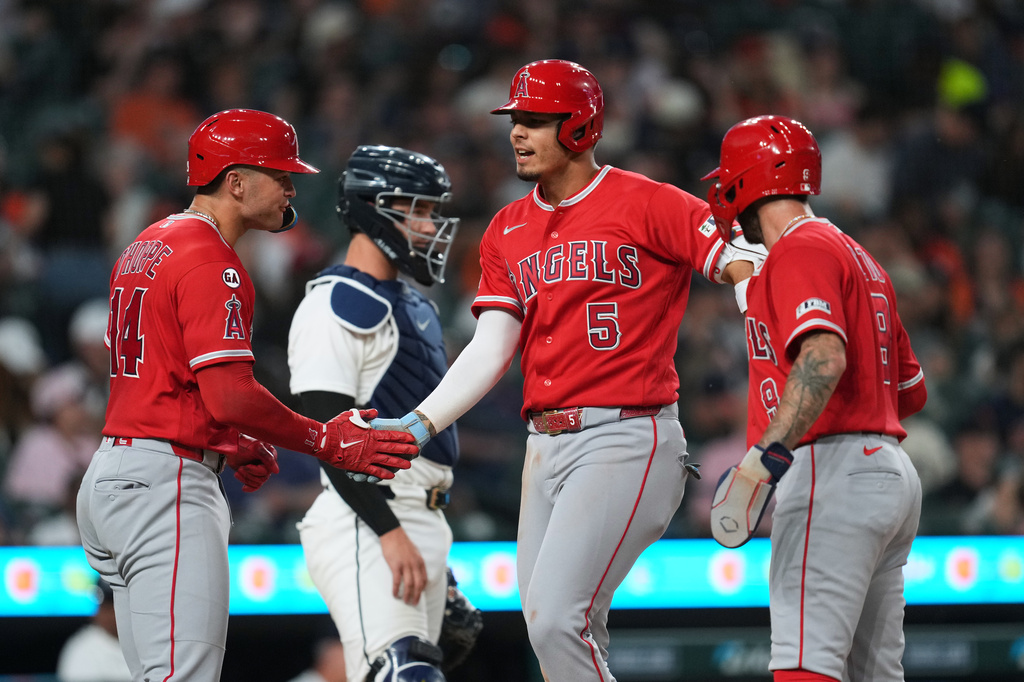 Los Angeles Angels' Vaughn Grissom (5) celebrates his grand slam with Logan O'Hoppe (14) and Zach Neto (9) against the Detroit Tigers during the eighth inning of a baseball game Tuesday, May 26, 2026, in Detroit. (AP Photo/Paul Sancya)