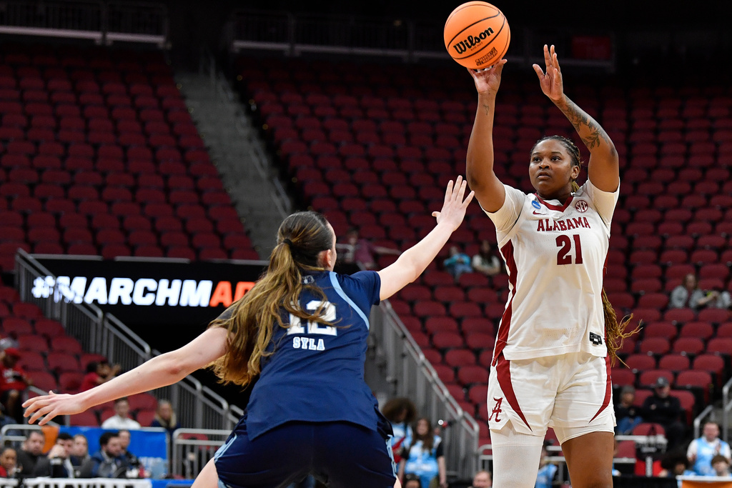 Alabama forward Essence Cody (21) shoots over Rhode Island center Albina Syla (12) during the second half in the first round of the NCAA college basketball tournament, Saturday, March 21, 2026 in Louisville, Ky. (AP Photo/Timothy D. Easley)