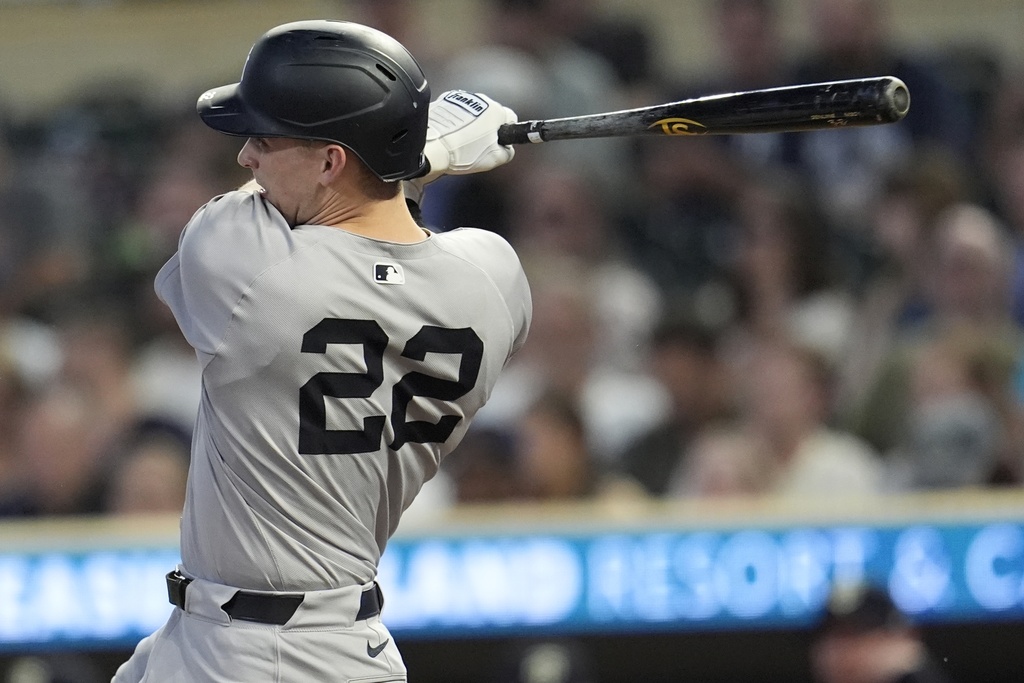 New York Yankees first baseman Ben Rice (22) hits ab RBI-double against the Minnesota Twins in the third inning of a baseball game, Tuesday, Sept. 16, 2025, in Minneapolis. (AP Photo/Mike Stewart)