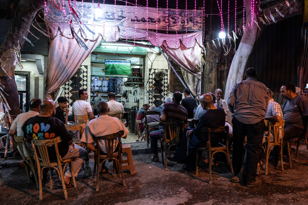 People watch the opening match of the FIFA World Cup 2026 between Mexico and South Africa, in Cairo, Egypt, Thursday, June 11, 2026. (AP Photo/Mahmoud Khaled)