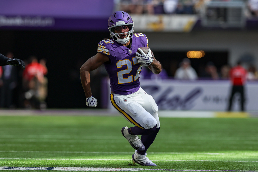 FILE - Minnesota Vikings running back Jordan Mason carries the ball during an NFL football game against the Green Bay Packers in Minneapolis, Sept. 13, 2026. (AP Photo/Stacy Bengs, File)