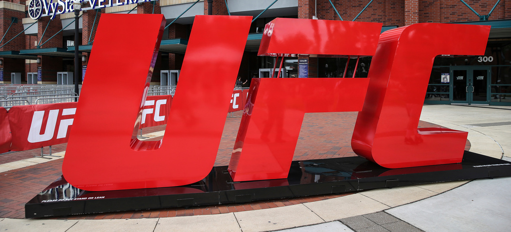 FILE - A UFC logo stands outside the arena, April 24, 2021, in Jacksonville, Fla. (AP Photo/Gary McCullough, File)
