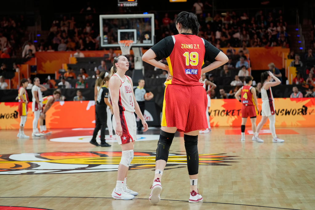 United States' Paige Bueckers talks to China's Zhang Ziyu during the Women's Basketball World Cup match between China and the United States in Berlin, Friday, Sept. 4, 2026. (AP Photo/Ebrahim Noroozi)