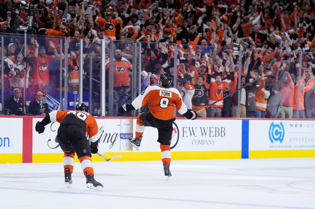 Philadelphia Flyers' Cam York (8) celebrates after scoring the game-winning goal during overtime in Game 6 against the Pittsburgh Penguins in the first round of the NHL hockey Stanley Cup playoffs series Wednesday, April 29, 2026, in Philadelphia. (AP Photo/Matt Slocum)