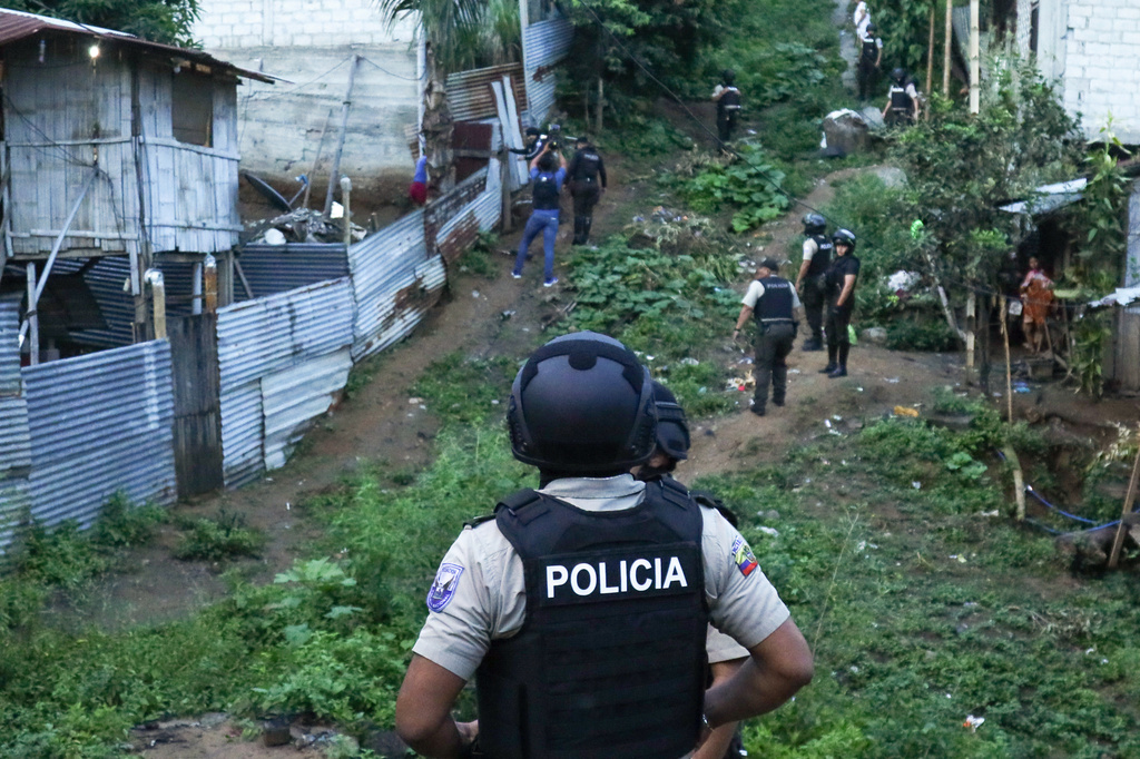 FILE - Police conduct an operation searching for weapons and or drugs as part of an effort to combat criminal groups, in the Nueva Guayaquil neighborhood of Guayaquil, Ecuador, April 4, 2024. (AP Photo/Cesar Munoz, File)