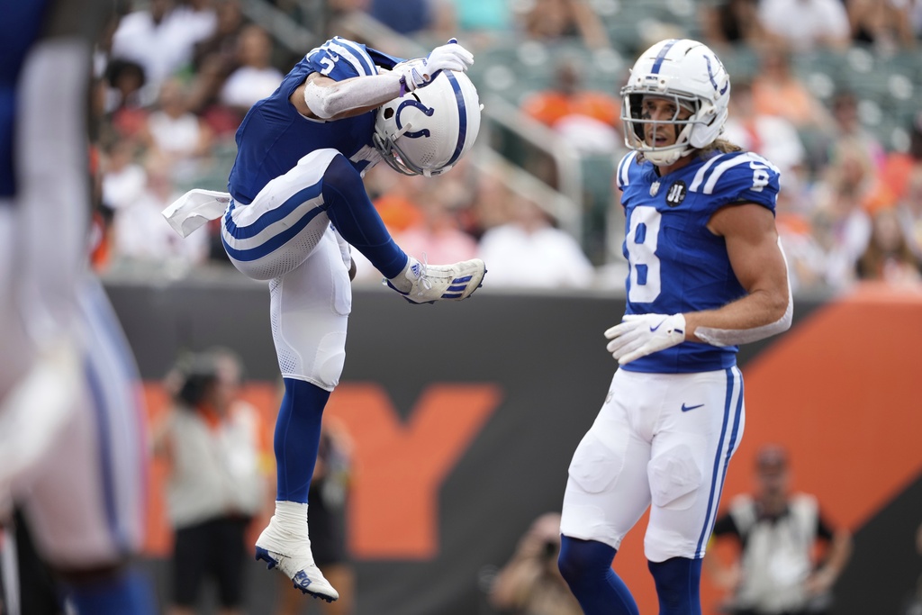 Indianapolis Colts wide receiver Coleman Owen celebrates a touchdown catch in front of wide receiver Landon Parker (8) during the second half of a preseason NFL football game, Saturday, Aug. 23, 2025, in Cincinnati. (AP Photo/Carolyn Kaster)
