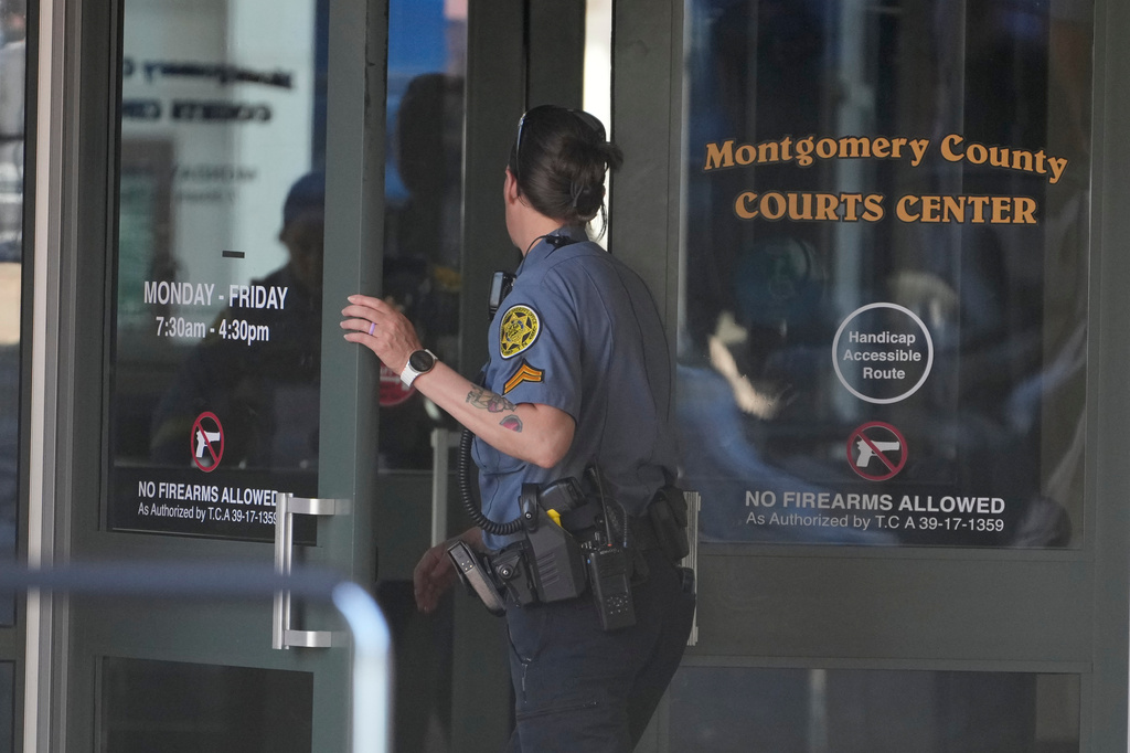 A Sheriff's deputy enters the Montgomery County Courts Center as they investigate a shooting outside the building, Wednesday, May 13, 2026, in Clarksville, Tenn. (AP Photo/George Walker IV)