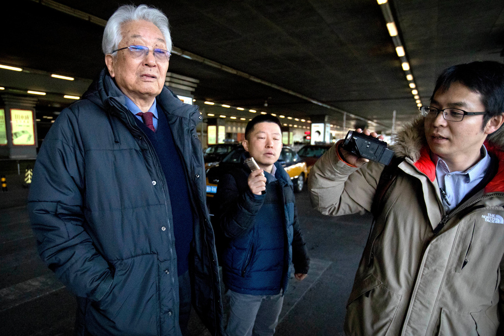 FILE - Then North Korea's IOC representative Chang Ung, left, arrives after a flight from Pyongyang at Beijing Capital International Airport in Beijing, on Jan. 16, 2018. (AP Photo/Mark Schiefelbein, File)