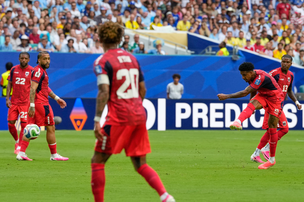 Cape Verde's Kevin Pina, second right, scores his team's first goalduring the World Cup Group H soccer match between Uruguay and Cape Verde in Miami Gardens, Fla., Sunday, June 21, 2026. (AP Photo/Rebecca Blackwell)