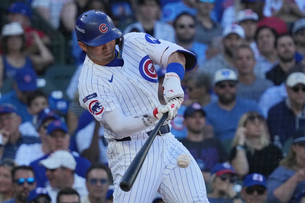Chicago Cubs' Seiya Suzuki- hits a home run during the fifth inning of Game 1 of a National League wild card baseball game against the San Diego Padres Tuesday, Sept. 30, 2025, in Chicago. (AP Photo/Nam Huh)