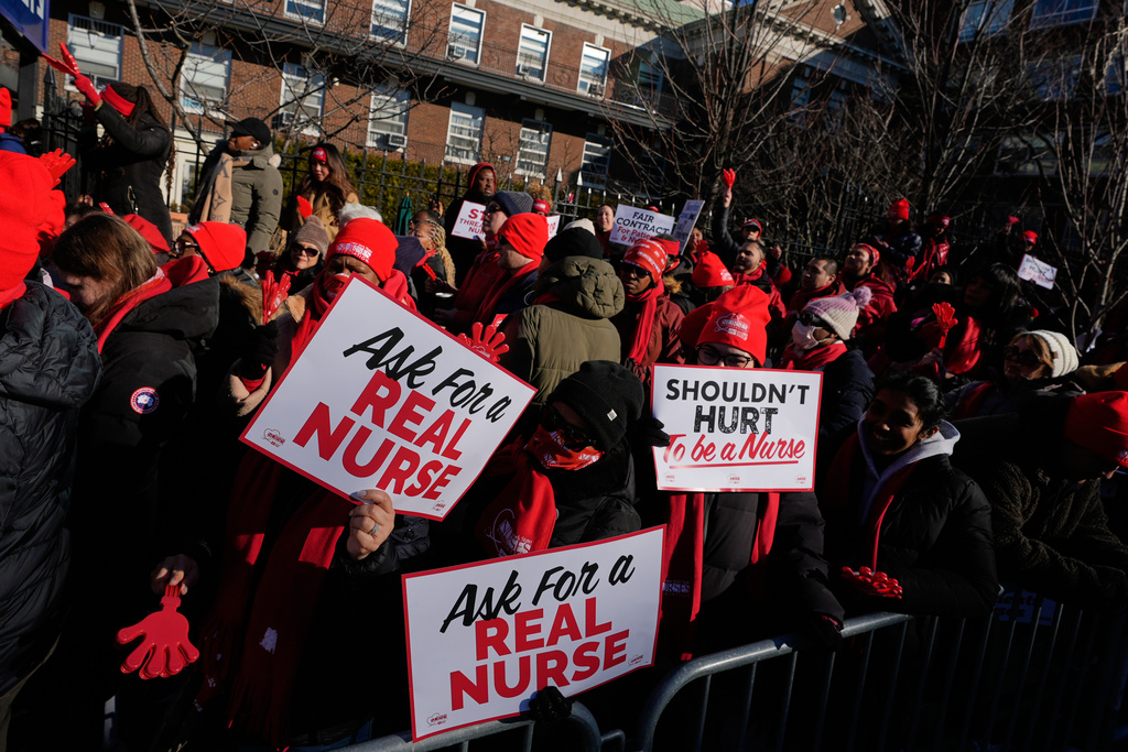 Nurses strike in front of Montefiore Hospital in the Bronx borough of New York, Tuesday, Jan. 13, 2026. (AP Photo/Seth Wenig)