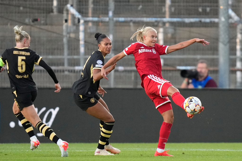 Bayern's Pernille Harder kicks the ball next to Manchester City's Jade Rose during the women's Champions League opening phase soccer match between FC Bayern Munich and Manchester City in Munich, Germany, Tuesday, Sept. 22, 2026. (AP Photo/Matthias Schrader)