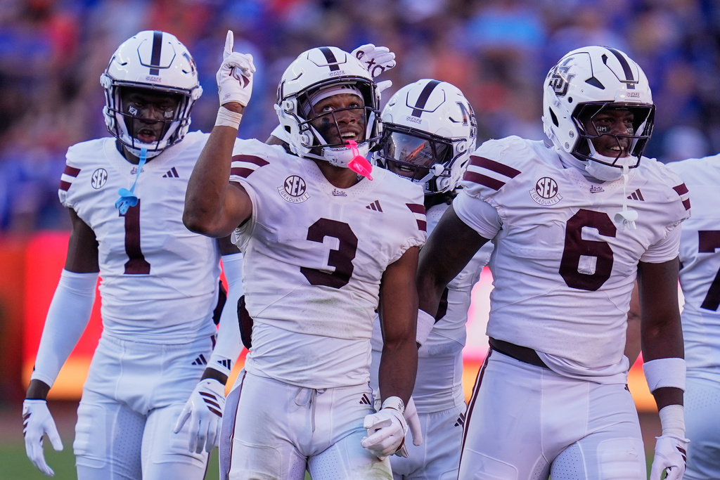 Mississippi State safety Brylan Lanier (3) celebrates with teammates after intercepting a Florida pass during the first half of an NCAA college football game, Thursday, Sept. 18, 2025, in Gainesville, Fla. (AP Photo/John Raoux)
