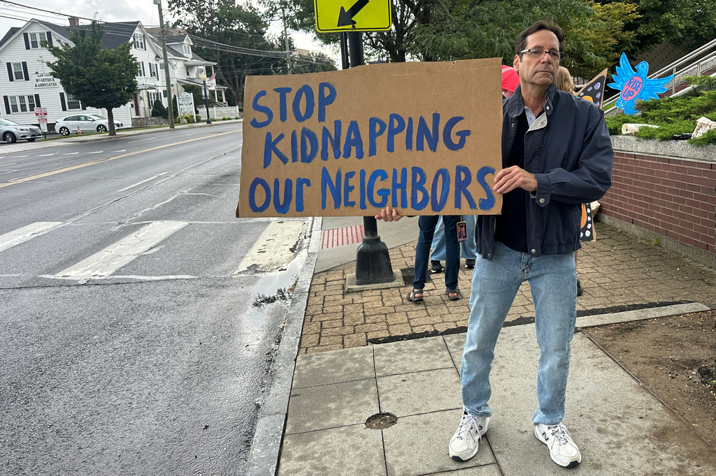 Anti-ICE activists gather outside a courthouse in Danbury, Conn., Thursday, Aug. 27, 2026. (AP Photo/Ted Shaffrey)
