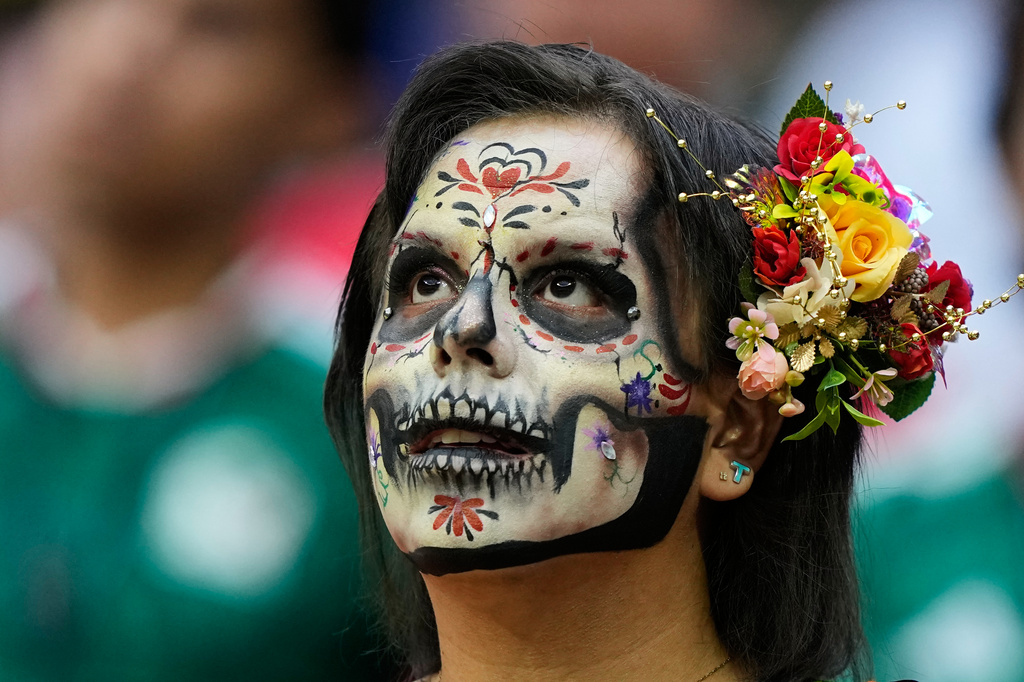 A Mexico fan wears a scary colourful makeup on the tribune ahead of the World Cup Group A soccer match between Czechia and Mexico in Mexico City, Wednesday, June 24, 2026. (AP Photo/Natacha Pisarenko )