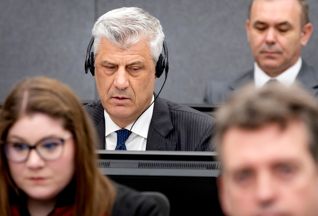 FILE - Former Kosovo president Hashim Thaci, top left, appears before the Kosovo Tribunal as he defends himself against charges including murder, torture and persecution allegedly committed during his country's war for independence from Serbia in the Hague, on April 3, 2023. (Koen van Weel/Pool via AP, File)