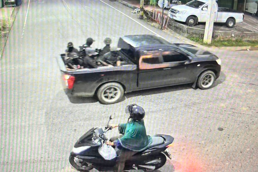 This image taken from video provided by Internal Security Operations Command Region 4 shows a group of the alleged attackers riding on a back of a black pickup truck before they opened fire and threw pipe bombs at soldiers at a security checkpoint in Narathiwat province, Thailand, Wednesday, July 22, 2026. (Internal Security Operations Command Region 4 via AP)