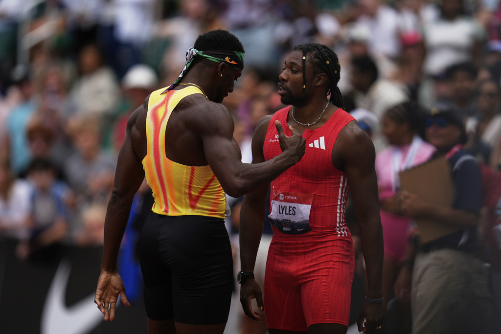 FILE - Noah Lyles and Kenny Bednarek talk after the men's 200-meter final at the U.S. Championships athletics meet in Eugene, Ore., on Aug. 3, 2025. (AP Photo/Abbie Parr, File)