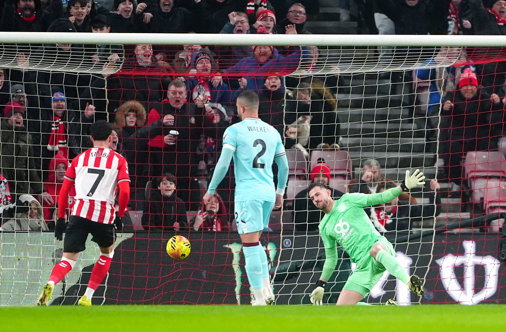 Burnley goalkeeper Martin Dubravka, right, fails to block a goal by Sunderland during a Premier League soccer match in Sunderland, Monday, Feb. 2, 2026. (Owen Humphreys/PA via AP)