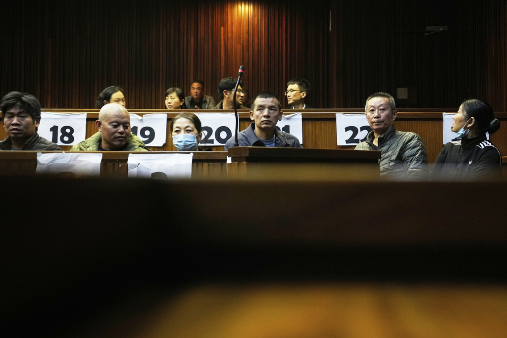 FILE - Convicted Chinese nationals during their appearance in the high court, in Johannesburg, South Africa, on April 29, 2025, for their human trafficking and child labour case. (AP Photo/Themba Hadebe, File)