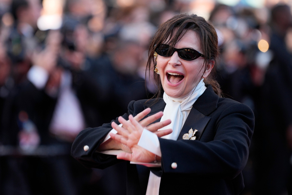 FILE -Juliette Binoche poses for photographers upon arrival at the premiere of the film 'Bitter Christmas' at the 79th international film festival, Cannes, southern France, May 19, 2026. (AP Photo/John Locher) File)