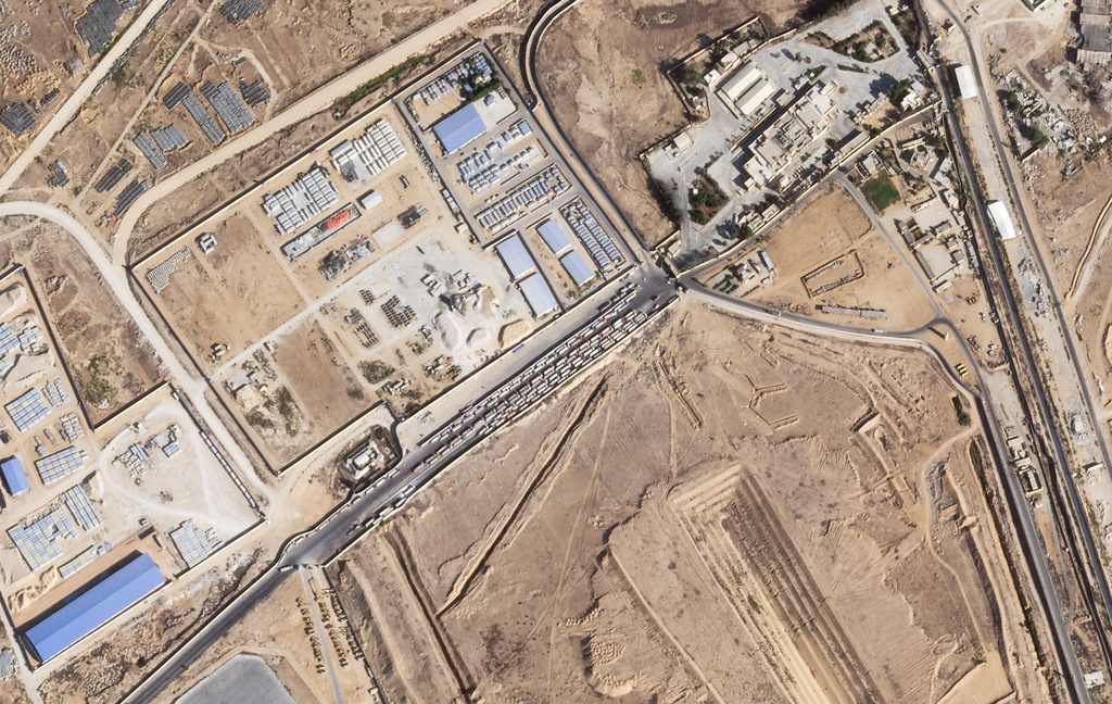 This satellite photo from Planet Labs PBC shows trucks lined up on the Egyptian side of the Rafah border crossing with the Gaza Strip on Thursday, Oct. 16, 2025. (Planet Labs PBC via AP)